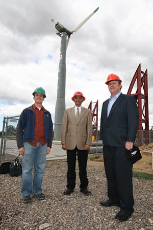 From left, UC San Diego engineering graduate student Ian Prowell is shown with structural engineering professor Ahmed Elgamal and Oak Creek Energy Systems Executive Vice President Ed Duggan at the UCSD Englerkirk Structural Engineering Center in Scripps Ranch where university researchers recently performed earthquake simulation tests on a wind turbine.