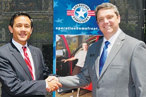 Rick Bregman, left, Bank of America’s San Diego market president, and Jim Knotts, Operation Homefront’s president and CEO, celebrated the grant of $250,000 given to Operation Homefront.