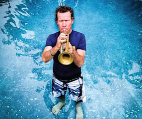 Professional trumpet player Roy Weigand somehow was convinced to pose with his instrument in his backyard pool in Burbank.
