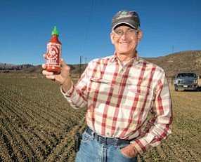 On the Farm: Craig Underwood at Ventura County fields where he plants jalapeño peppers for sauce.