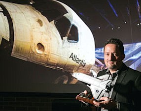 Far Out: Mousetrappe CEO Daren Ulmer with prop from space shuttle exhibit.