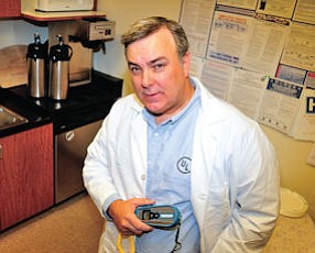 Auditor: Executive Bill Flynn at Everclean Services’ offices in Agoura Hills, with instrument used to test food temperature.