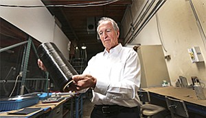 
Where it all begins: Tim Knowles holds a spool of carbon fiber, which his company, Kulr Technology Corp., transforms into heat sinks and a new system to prevent thermal runaway in lithium-ion batteries. Knowles has done extensive work on NASA spacecraft. 