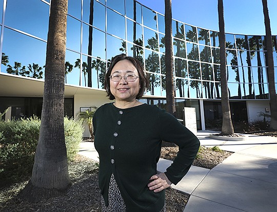 Hong Cai, the CEO of Mesa Biotech, at the company’s headquarters. “Never underestimate integration,” she said of developing the company’s flu and respiratory test platform.