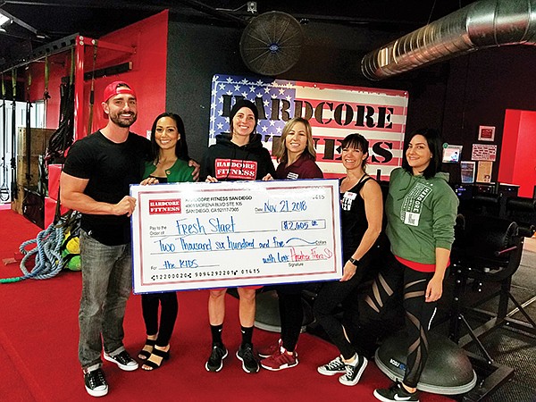 Tommy Reynolds, left, Vanessa Reynolds, Kailey Rowan, Suzi Euell, Stephanie O’Conner and Daysi Baeza present a $2,600 check to Fresh Start Surgical Gifts. Photo courtesy of Hardcore Fitness San Diego