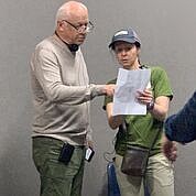Joey Travolta, founder of Inclusion Films, works with a crew member. Photo courtesy of Inclusion Films