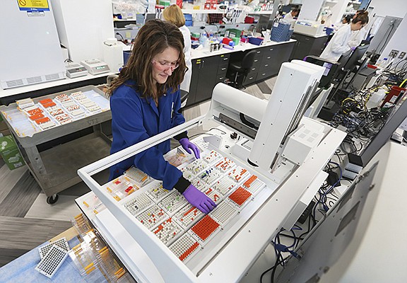 Vividion’s Paige Schaffer works in the company’s lab at its prior location. The company’s drug-discovery platform targets “undruggable” proteins.