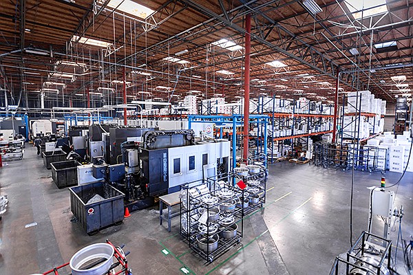 HRE Performance Wheels manufacturing facility and headquarters in Vista. The 60,000-square-foot manufacturing facility is where each custom order is processed, designed and forged or cast from aluminum cylinders. The wheels are then polished, painted and shipped to a number of destinations including Los Angeles, London, Germany and China. Photo courtesy of HRE Performance Wheels