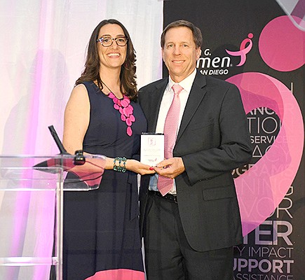Michael Fontaine, COO and CFO of Plaza Home Mortgage accepting the Laura Farmer Sherman Award from Susan G. Komen San Diego President and CEO, 
Shaina Gross. Photo courtesy of Plaza Home Mortgage Inc.
