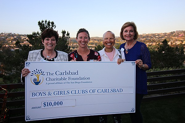 The San Diego Foundation Incoming Board Chair P. Kay Coleman, left, Boys & Girls Club of Carlsbad Teen Director, Liz Hopley; The San Diego Foundation Board Member, Donna Marie Robinson, and Carlsbad Charitable Foundation Board Chair Sandy Lund at the Carlsbad Charitable Foundation grant check presentation to the Boys & Girls Club of Carlsbad. Photo courtesy of the Carlsbad Charitable Foundation