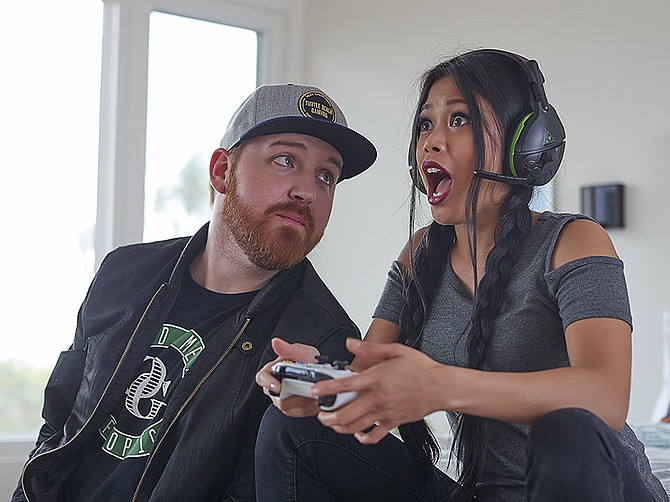 The Stealth 600 is a wireless headset from Turtle Beach. At left is Di3seL, a celebrity gamer.