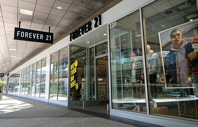 Clock Out: Forever 21 plans layoffs.