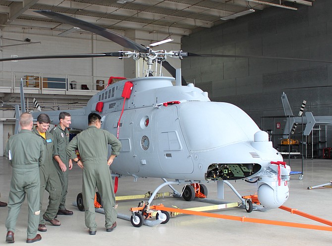 Officers inspect a Fire Scout aircraft at the Point Mugu naval base in 2015. Photo courtesy of U.S. Navy.
