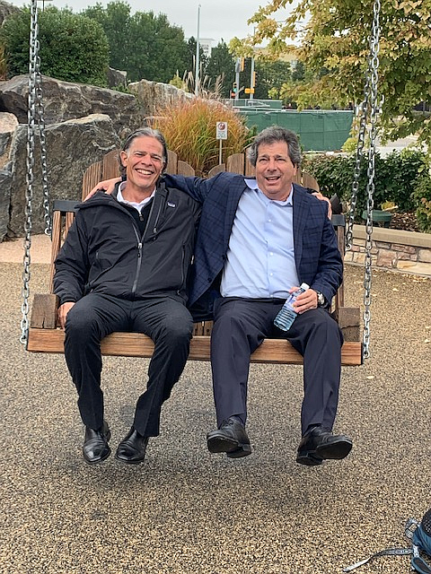 NewMark Merrill's Allen Ginsborg, left, and Sandy Sigal on swing.