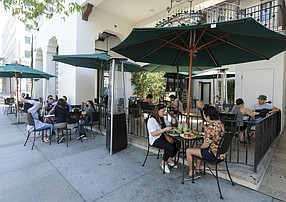 Patrons dining at outside of Urth Cafe in Pasadena. (Photo by Ringo Chiu).