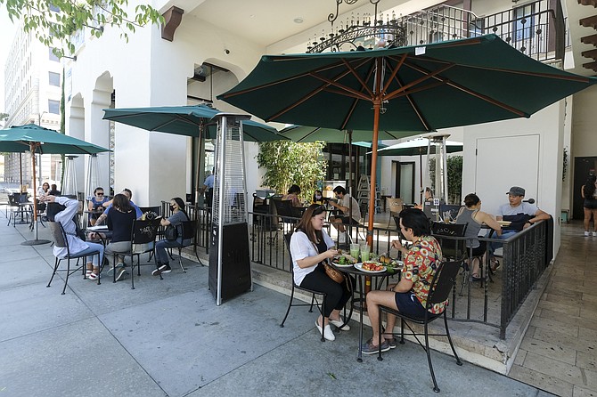 Patrons dining at outside of Urth Cafe in Pasadena. (Photo by Ringo Chiu).