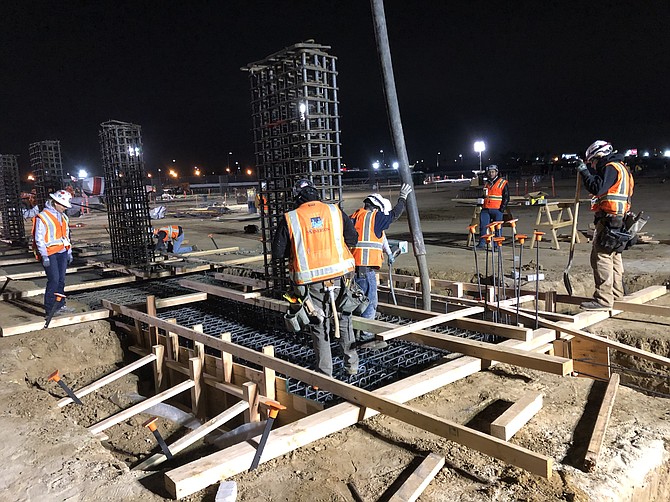 Crews pour the concrete foundation for a new parking structure and intermodal transportation hub at LAX.