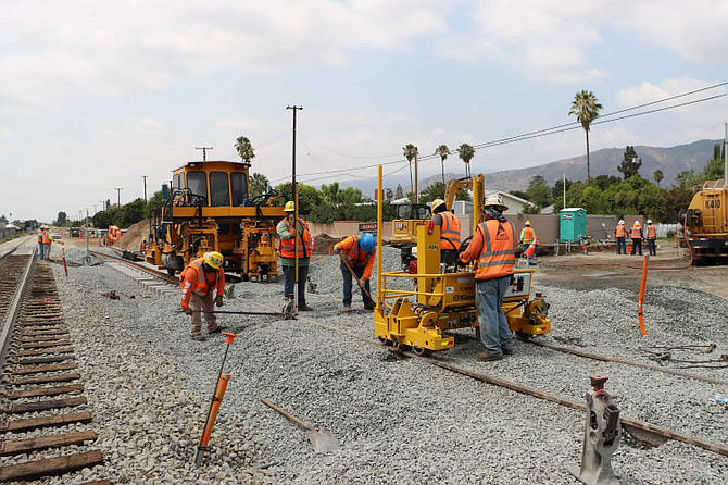 Crews are working on light rail systems such as the Loraine Avenue crossing in Glendora.