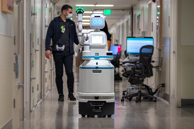 Nurses test a Moxi robot at the Cedars-Sinai accelerator.