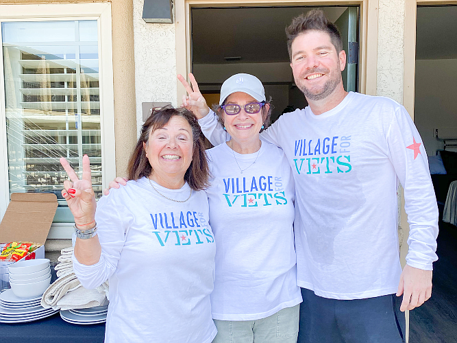 Marcie Polier Swartz, Founder of Village for Vets (middle) with volunteers, helping unpack move-in kits and prepare apartments for homeless veterans moving into permanent supportive housing