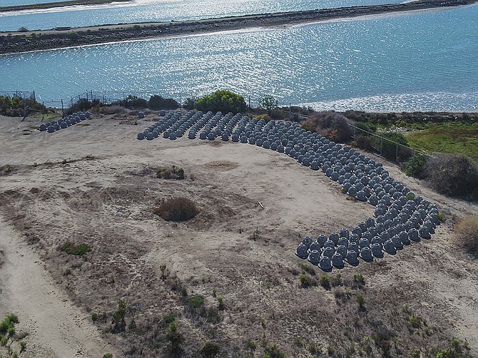 Photo courtesy of the Port of San Diego
Reef balls sit in a staging area prior to installation. An artificial reef of reef balls has been installed in Chula Vista near the Chula Vista Wildlife Refuge as a way to combat rising sea levels.