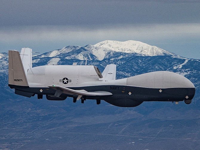 Photo courtesy of Northrop Grumman Corp.
B8, a production U.S. Navy Triton aircraft carrying a sophisticated intelligence electronics package, is seen over the California desert prior to its delivery to Naval Air Station Patuxent River on Feb. 1. The Northrop Grumman team overseeing the Triton project is based in Rancho Bernardo.