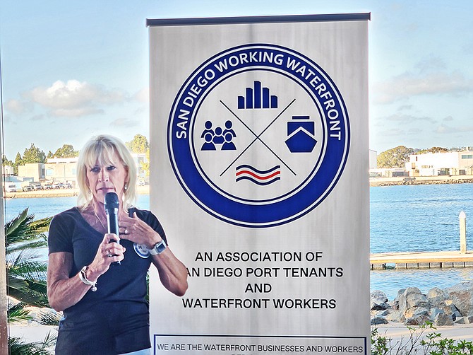 Sharon Bernie-Cloward shows off the new San Diego Working Waterfront logo at an event at the Bali Hai on Shelter Island on April 21. Photo by Karen Pearlman