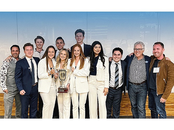 USD NAIOP team and advisors: Jacob Schwartz of Urban Housing Partners (left); Nash Johnson ’22; Casey Engelman of Urban Housing Partners; Caleigh Schmitt ’22; Aaron Fierros ’22; Abigail Montelli ’22; Madelyn Hofele ’22; Bryce Meichtry ’22; Karla Olmos ’22; Nicholas (Nick) Bost ’22; Stath Karras of the Burnham-Moores Center for Real Estate; and John Martinez of Carrier Johnson + CULTURE. Photo courtesy of Burnham-Moores Center for Real Estate, Knauss School of Business, University of San Diego
