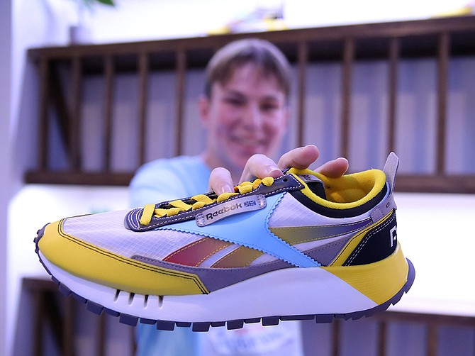 Scripps Ranch High alum Ben Gass holding the Reebok shoe he helped design, create and market along with two other young entrepreneurs at the APB launch event in April in Columbia, S.C. 
Photo courtesy Yellowbrick