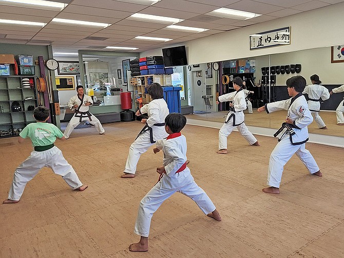 Miramar Martial Arts Academy Founder and Owner Tom Thai teaches students on a Saturday morning at the studio on Mira Mesa Boulevard. (Photo by Karen Pearlman)