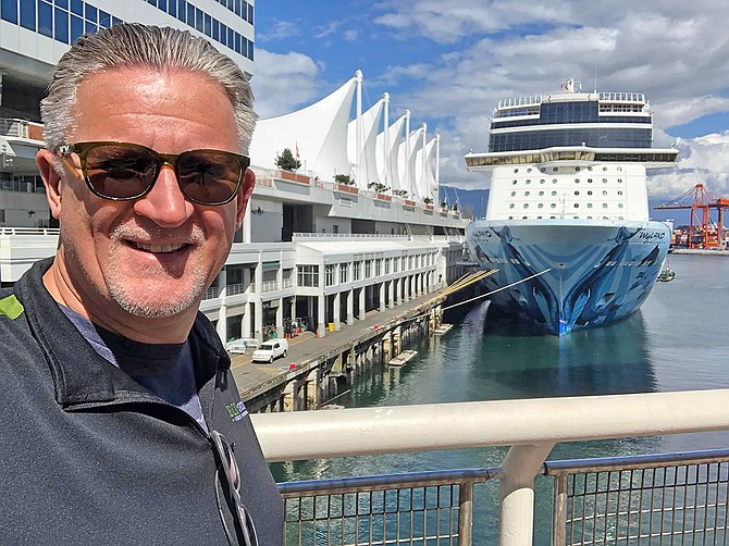 Adam Martindale takes time to pose in Vancouver at Canada Place Cruise Terminal during a recent trip north. Photo courtesy Adam Martindale