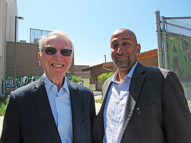 Irwin Jacobs, co-founder of Qualcomm, and Sidd Vivek, CEO of Junior Achievement of San Diego County, take a moment to pose at Lincoln High School after a cohort of juniors at the school are lauded for the JA Fellows Spring Semester Showcase. Photo by Karen Pearlman