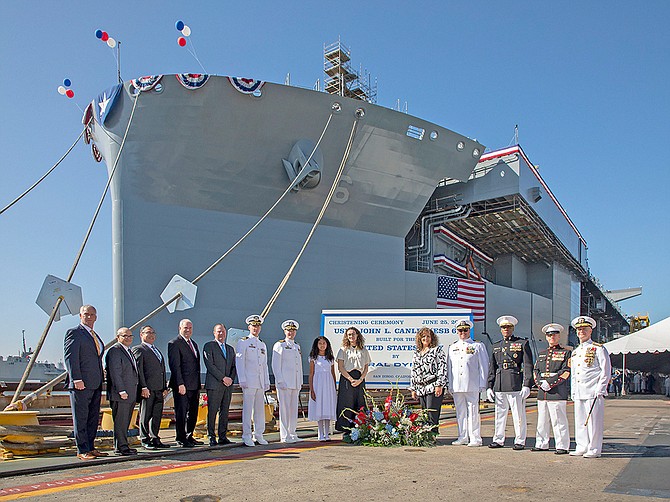 Dignitaries take time out from christening ceremonies to pose in front of the USNS John L. Canley on June 25. Photo courtesy of General Dynamics NASSCO